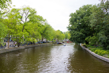 Fototapeta na wymiar Canal for boat transport in Amsterdam city