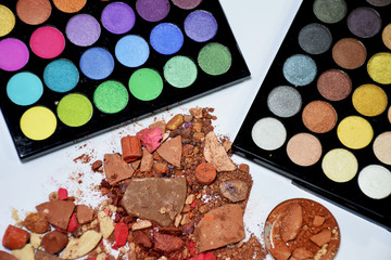 Eye shadow colorful shattered into powder. Make up brush.