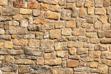 Vintage grunge sandstone blocks wall texture.