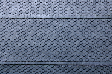 Aged slate roof tiles close-up