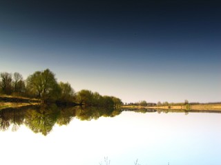 Fototapeta premium landscape with hatching of the water surface of the pond
