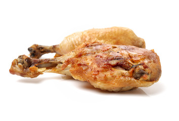 Barbecued chicken leg on white background