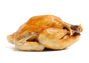 Whole roasted chicken against white background