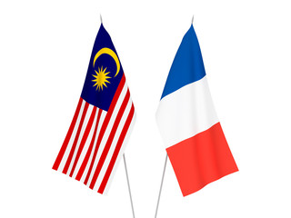 National fabric flags of France and Malaysia isolated on white background. 3d rendering illustration.