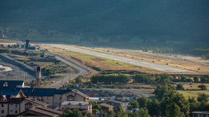 Aerial view of Mestia Valley from Hatsvali (Khatsvali) ski resort cableway. Airport of Mestia, Georgia.