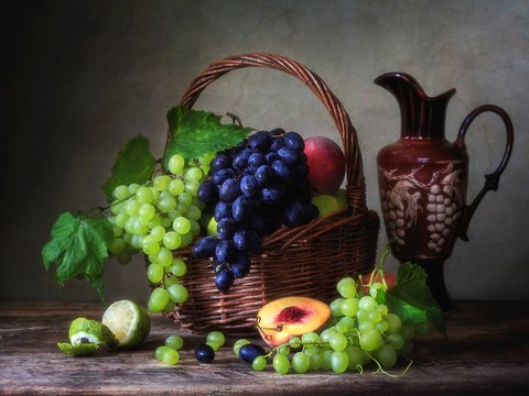 Still life with basket of grapes