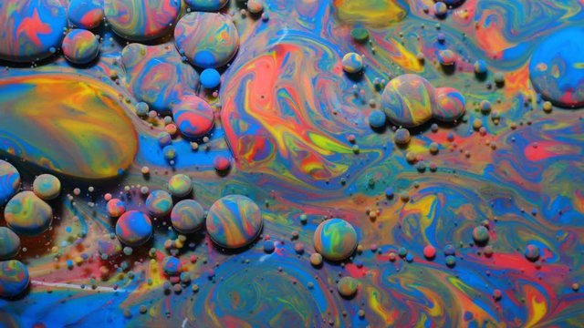 Slow Motion Bright Colors Bubbles Oil Beautiful Paint Universe Color Moving Multicolored Close Up. Acrylic Paint. Fantastic Hypnotic Surface. Abstract Colorful Paint Metamorphosis Structure Bubbles