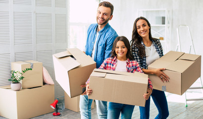 To boxes! The whole family is eager to unpack the boxes with the household items and furnish their...