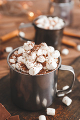 Cup of hot chocolate with marshmallows on table
