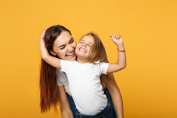 Woman in light clothes have fun with cute child baby girl 4-5 years old. Mommy little kid daughter...