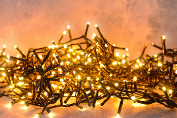 Beautiful Christmas garland on light background © Pixel-Shot