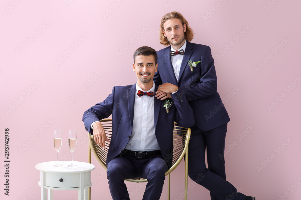 Sticker Portrait of happy gay couple on their wedding day against color background