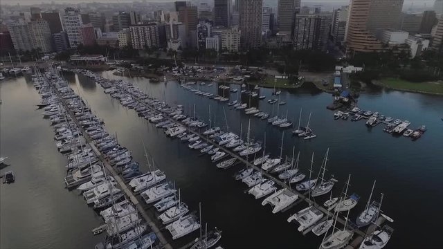 Aerial over Durban Yachts and city Skyline