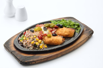 Hot platter of filling wrapped in two cripsy corn tortillas topped with cheese