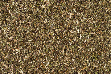 Dried oregano texture. Background with copyspace. Close up. Top view