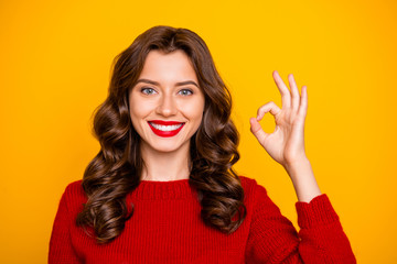Photo of cheerful cute pretty nice girlfriend showing you ok sign smiling toothily isolated over...