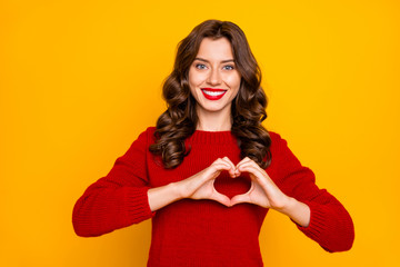 Photo of charming cheerful cute pretty sweet girlish feminine girlfriend showing you heart like sign isolated over yellow vivid color background