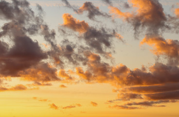 Clouds at sunset. Orange and black clouds at sunset