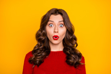 Photo of charming cute nice attractive fascinating pretty girlfriend shocked with something wearing red sweater isolated over yellow vivid color background