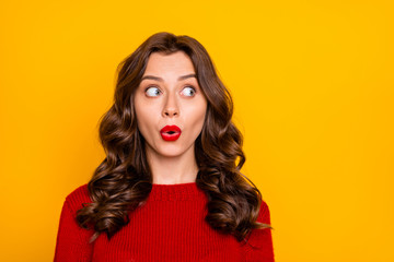 Photo of cute charming nice pretty funny girlfriend shocked with something going on away from her wearing red sweater isolated over yellow vibrant color background