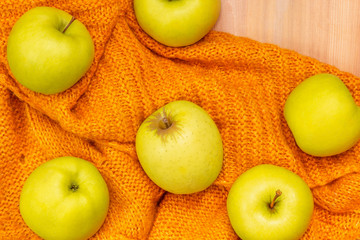 Autumn composition. Apples on knitted plaid. Harvest. Happy Thanksgiving concept. Flat lay, top view