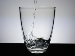 Fill the glass with water.