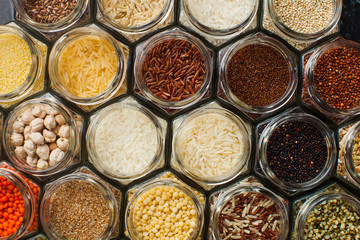Food pattern background - beans and cereals in jars