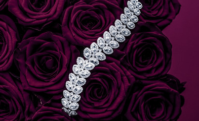 Luxury diamond jewelry bracelet and purple roses flowers, love gift on Valentines Day and jewellery...