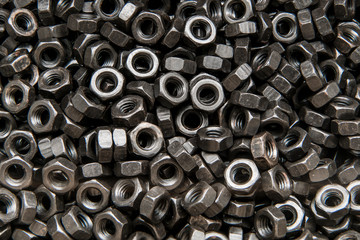 Black steel Nuts. Bolt and Nut in metal. Rusty steel.
