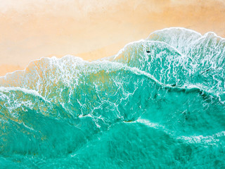 Top view of green turquoise sea water. Capture sea wave and beach in summer.