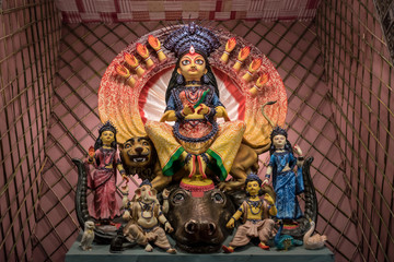 Idol of Goddess Devi Durga at a decorated puja pandal in Kolkata, West Bengal, India. Durga Puja is a popular and major religious festival of Hinduism that is celebrated throughout the world.