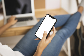 Hand holding a phone mock up