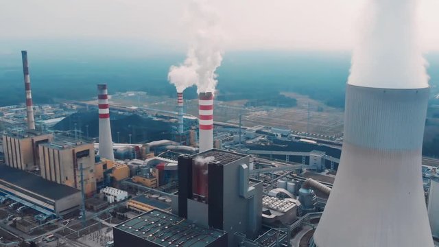 Air Pollution Concept. Power Plant With Smoke From Chimneys. Drone Shot