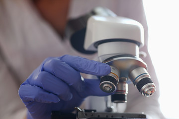 Fototapeta na wymiar The head microscope on the background laboratory is a study human biology analyzes for non-compliance with the requirements organization public health at international level