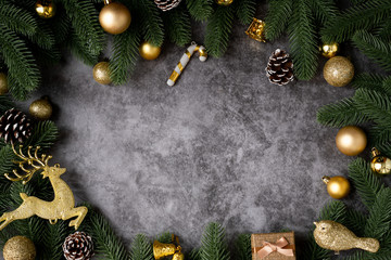 Copy space on Christmas frame background with gold christmas decorations  on wooden board.