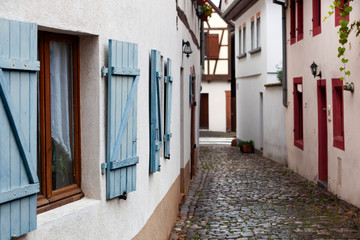 Fototapeta na wymiar Wet narrow street in Wissembourg in France