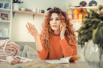 Attractive young woman actively gesticulating during talk