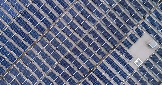 vertical circular panorama of solar panels on factory roof