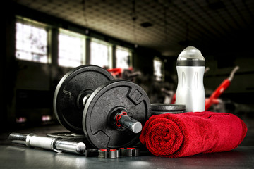 Fototapeta na wymiar Gym interior and dumbbells on black desk with free space for your decoration. 