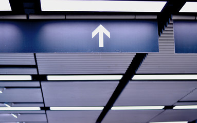 The arrows on the signs  in the airport.