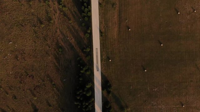Top view and following the evening road in the rays of the sunset. Croatia, august 2019