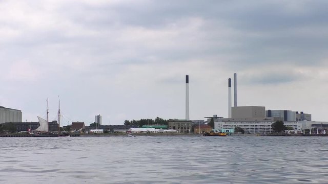 Copenhagen, Denmark - 13 JULY, 2019: Time laps video of Copenhagen harbor under dramatic clouds in summer day