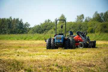Tractors in the field. Agricultural machinery
