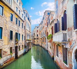 Fototapeta na wymiar water channel between old buildings in Venice