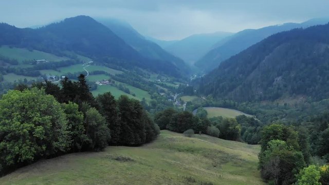 Beautiful drone footage of a valley near Annaberg, Austria on a foggy summer morning.