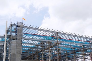 The structure of building with blue sky and clound as a background, Steel construction in large...