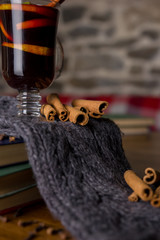 Mulled wine in glass cup with spices.