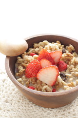 Healthy breakfast, granola in wooden bowl