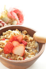 Healthy breakfast, granola in wooden bowl