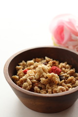 Healthy breakfast, granola in wooden bowlHealthy breakfast, granola in wooden bowl